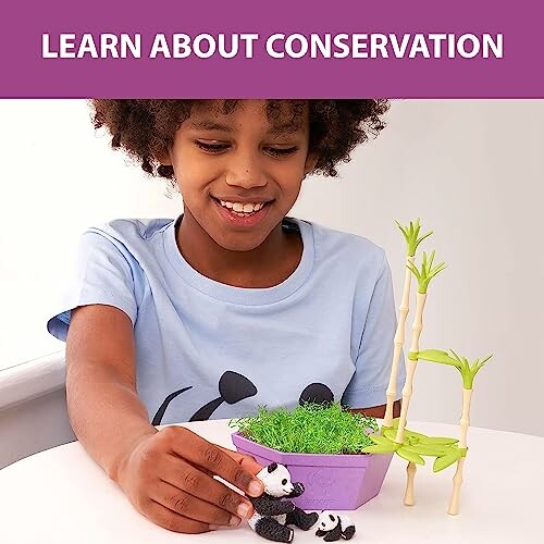 Child playing with a conservation-themed toy featuring pandas and bamboo.