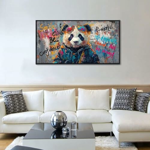 A colorful graffiti-style painting of a panda wearing sunglasses on a wall above a modern sofa.