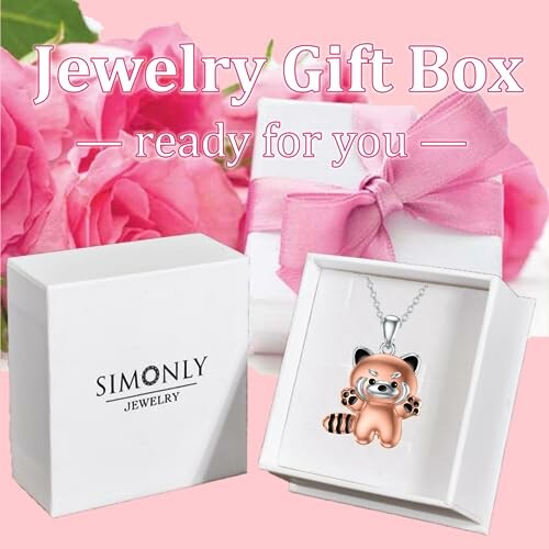 Jewelry gift box with pink ribbon and cute pendant.