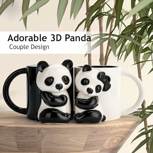 3D panda couple design mugs on wooden surface