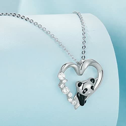 Silver heart-shaped panda necklace with gemstones