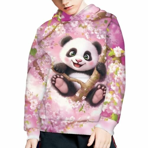 Child wearing a hoodie with a cute panda design amidst cherry blossoms.