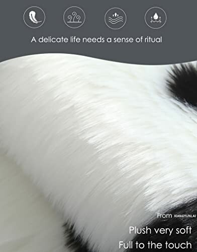 Close-up of soft plush fabric with white and black fur texture.