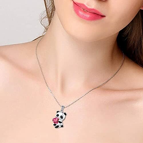 Woman wearing a panda necklace with a pink flower